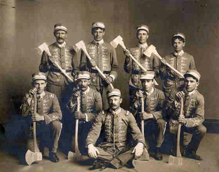 Firefighters holding axes