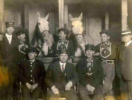 Old photo of firefighters with horses