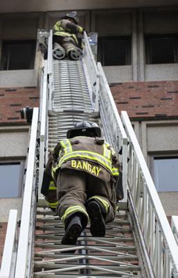 Chico Firefighters going up a ladder