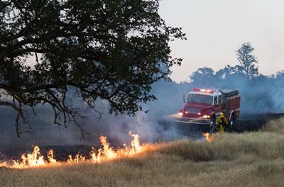 A fire engine on the scene of a fire