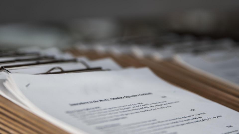 papers on clipboards