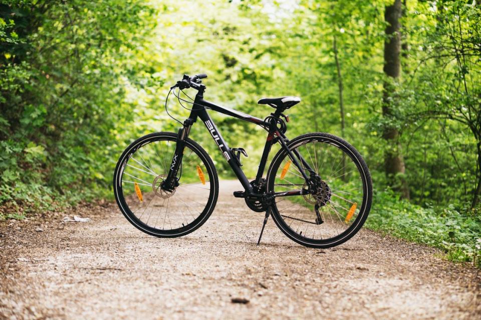 black mountain bike on trail
